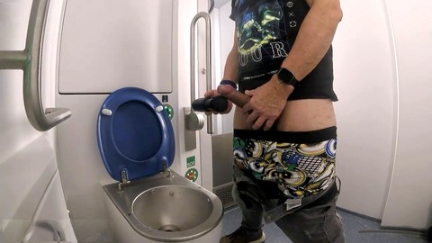 Inexperienced funnyboy Ger gets handsfree pleasure in a driving instructor's toilet with a massage gun HD Gay movie